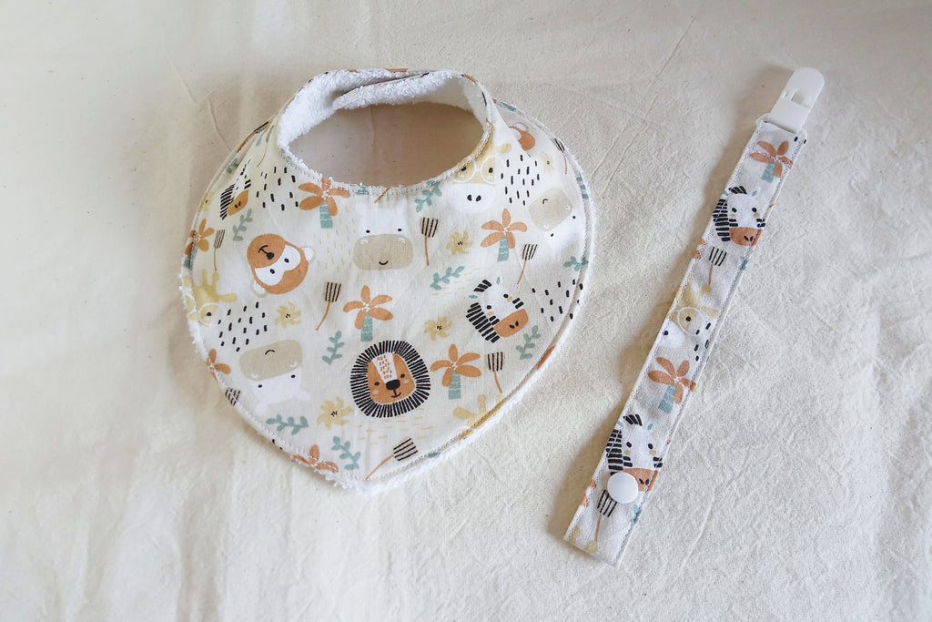 Set nascita artigianale Savana - Bavaglino bandana e porta ciuccio